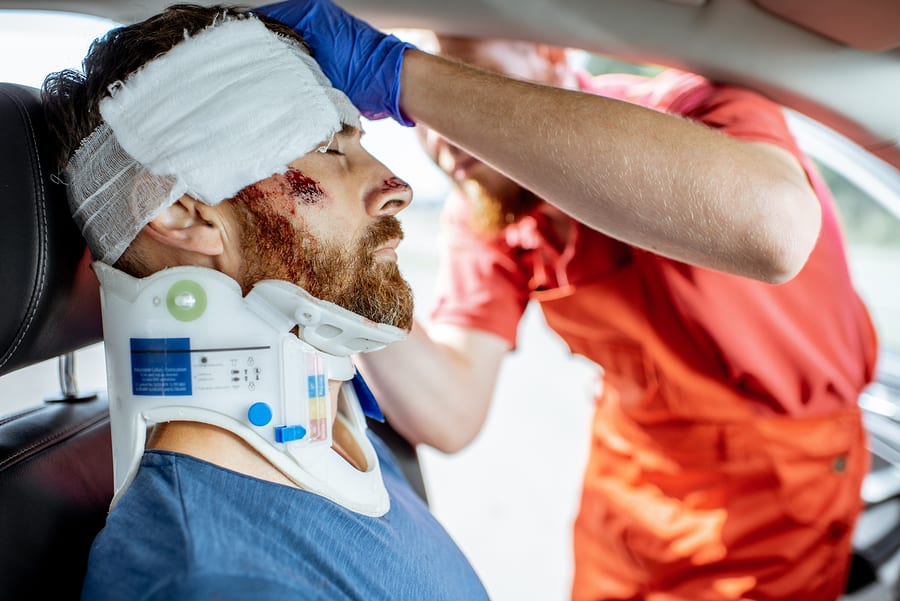 Medic Applying Bandage On The Head Of Victim With Serious Damage